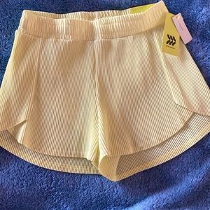 All In Motion pleated running shorts with inner brief liner. 
Multi sizes